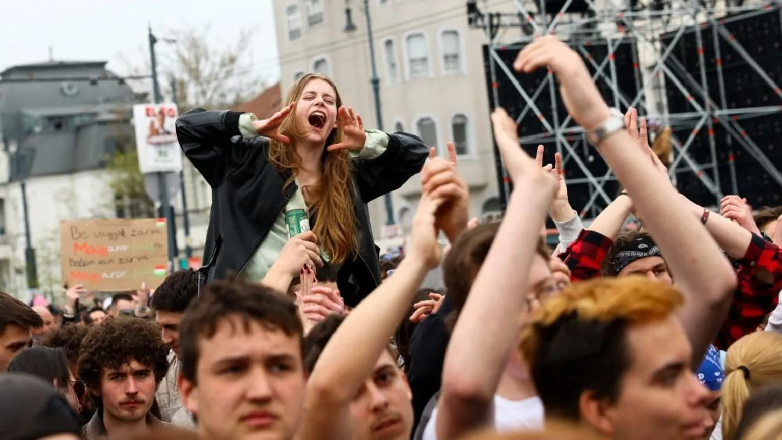 A woman on someone's shoulders during a protest