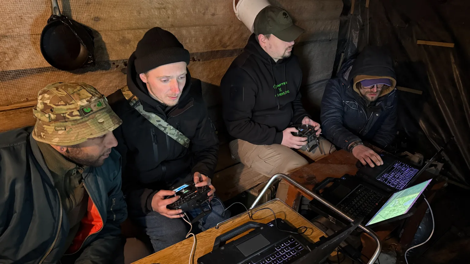 Members of a drone unit training inside a building.