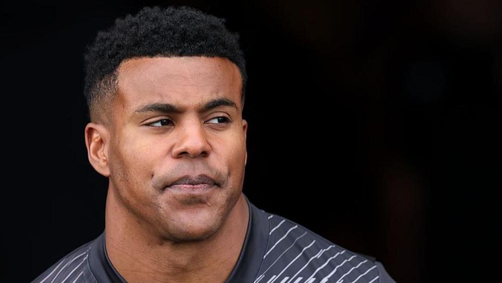 Manny Feyi-Waboso looks serious in a grey Exeter Chiefs training top 