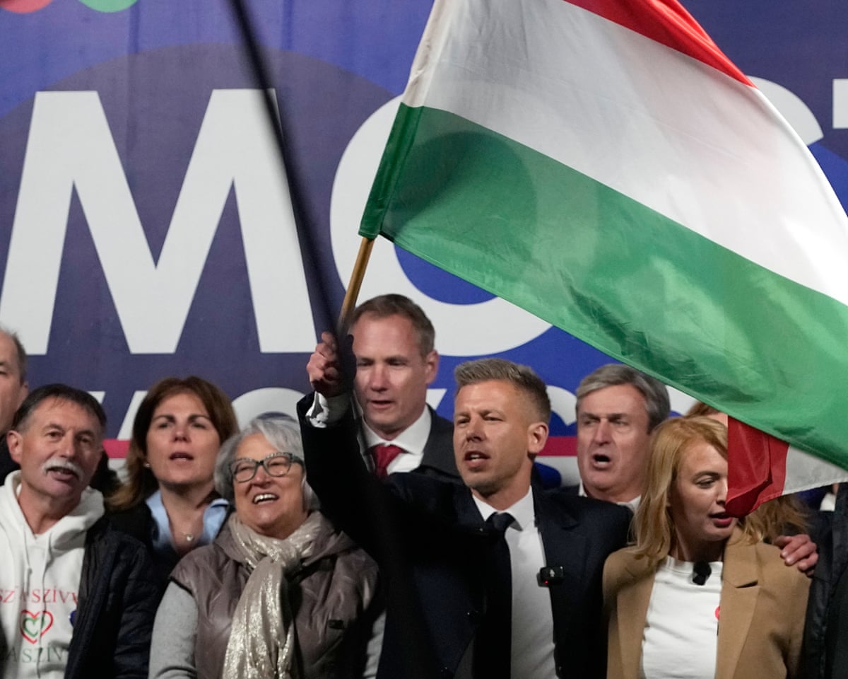 Péter Magyar, the leader of the opposition Tisza party waves a national flag during a rally in Debrecen, Hungary