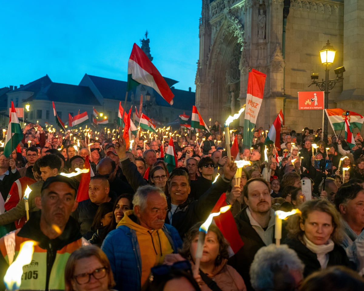 People hold torches during a Fidesz party rally with prime minister Viktor Orbán in Budapest, Hungary.