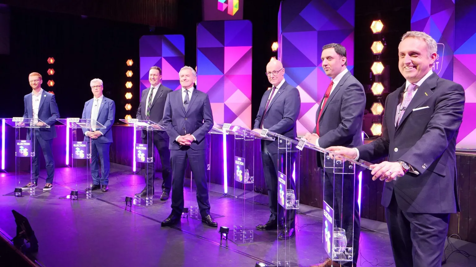 The party leaders at the debate, with host Stephen Jardine in the middle.