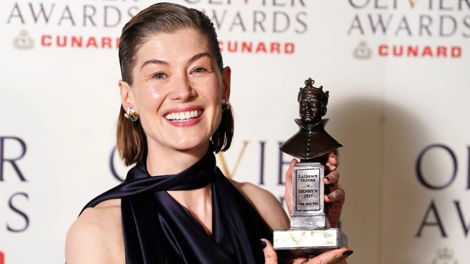 Rosamund Pike with her Best Actress award for Inter Alia at The Olivier Awards at the Royal Albert Hall, London