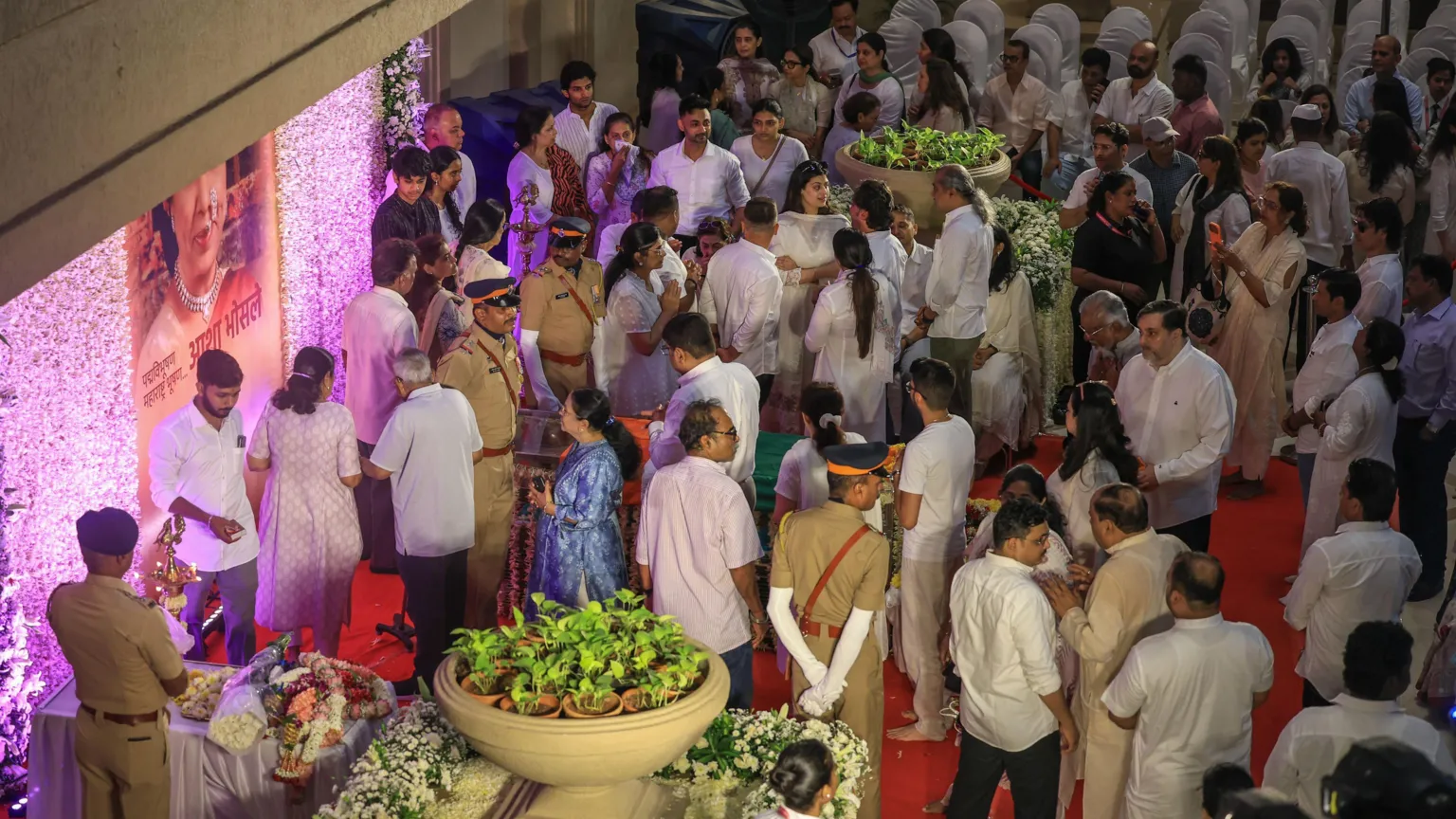 EPA People gather around the casket of Asha Bhosle in Mumbai to pay their respects