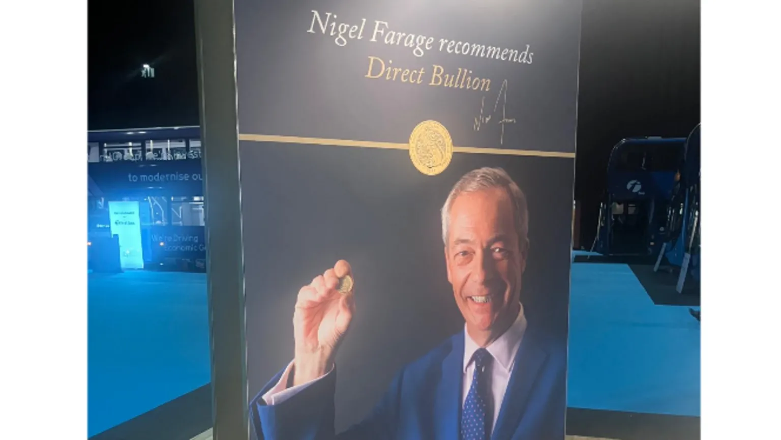 A photo taken at a Reform UK party conference of a large, vertical, freestanding advertising hoarding with the slogan: 