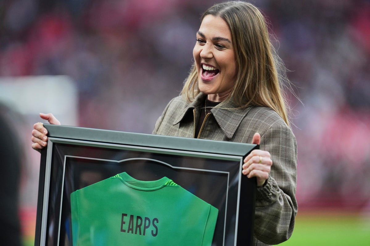 England's former goalkeeper Mary Earps reacts when honoured for her international career.