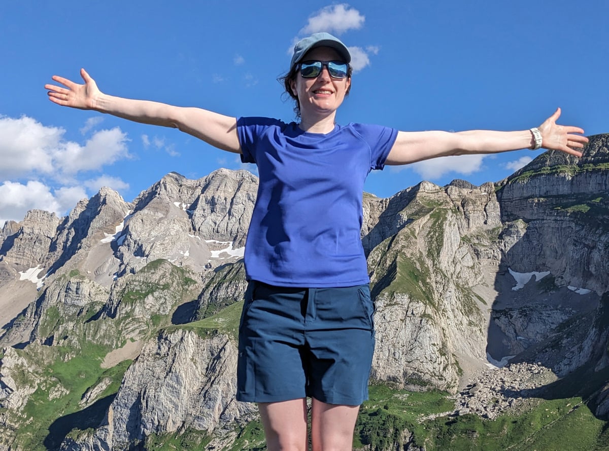 Woman with arms outstretched in Switzerland.
