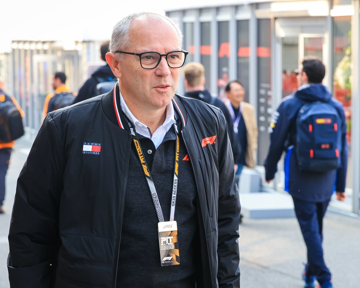 Stefano Domenicali, the head of F1, walks in the Suzuka paddock