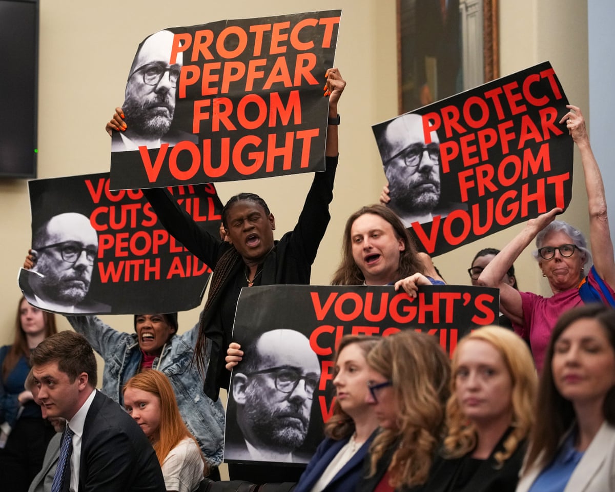 Demonstrators interrupt proceedings as White House Office of Management and Budget director Russell Vought testifies on Wednesday.