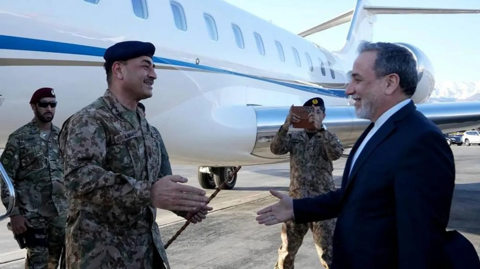 EPA Pakistan's army chief arrives off a plane in Tehran.