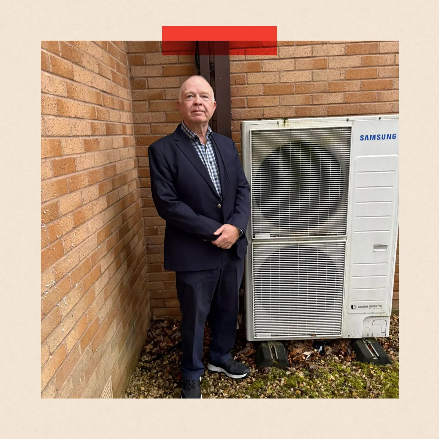 Gavin Tait Gavin Tait stands next to his heat pump