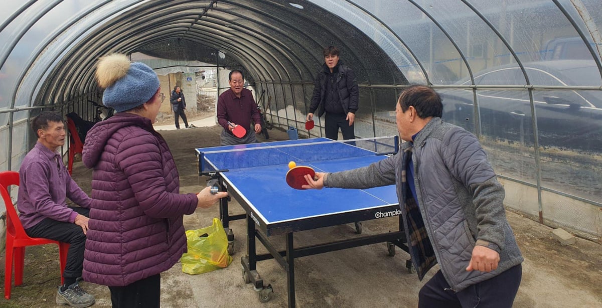 Villagers play table tennis