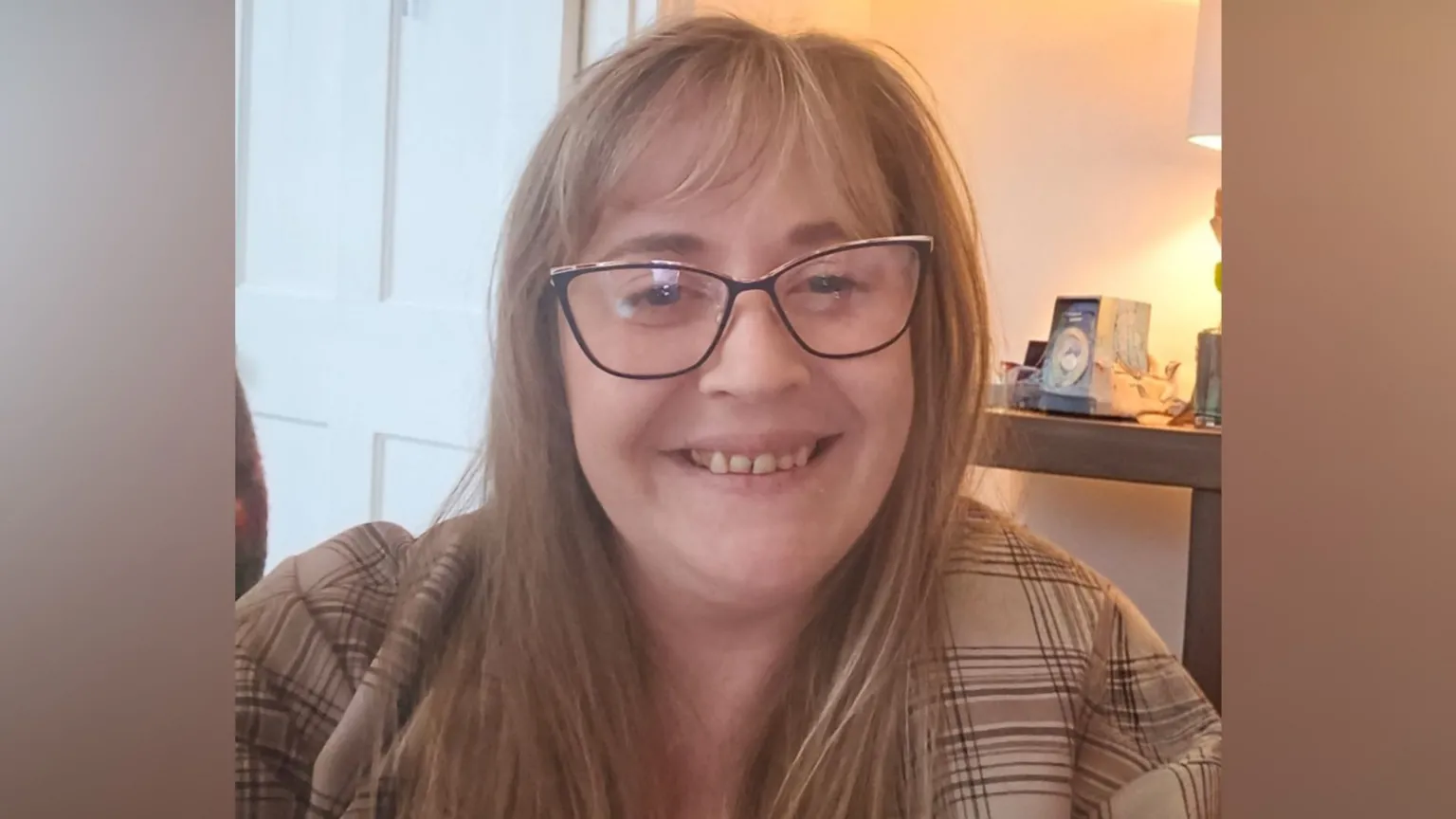 Mel Collins Mel Collins smiles at the camera. She has long light brown hair and wears a cream coloured top with brown lines on it.