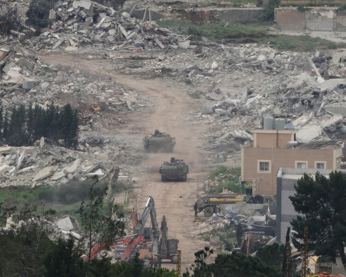 Israeli army vehicles and bulldozers operate in southern Lebanon on Wednesday.