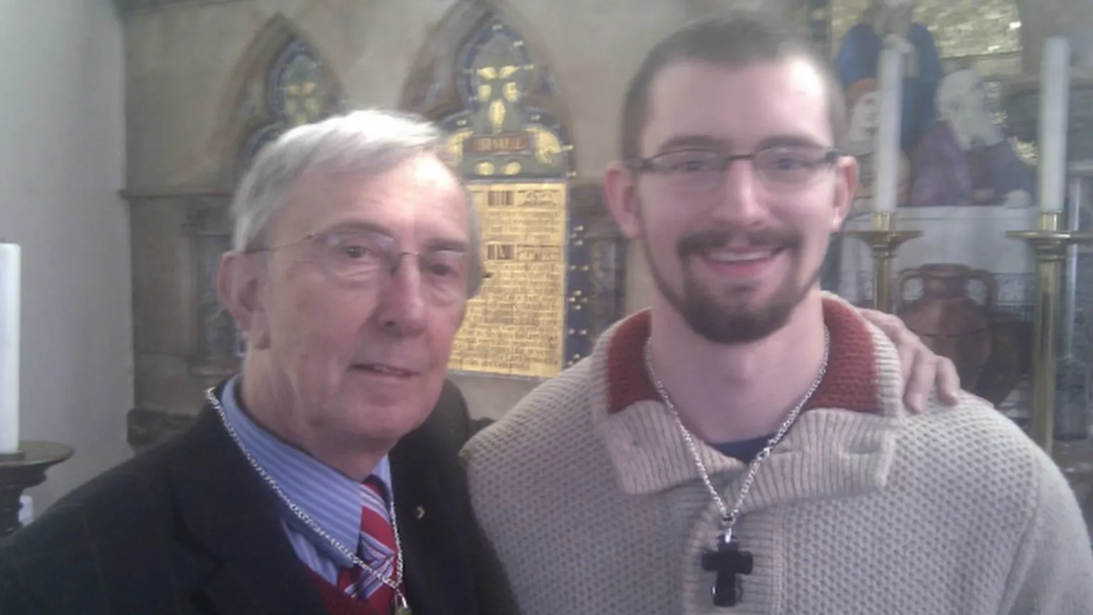Thames Valley Police An older man, Peter Farquhar, has his arm around Ben Field who is wearing a crucifix. They are stood in a church.