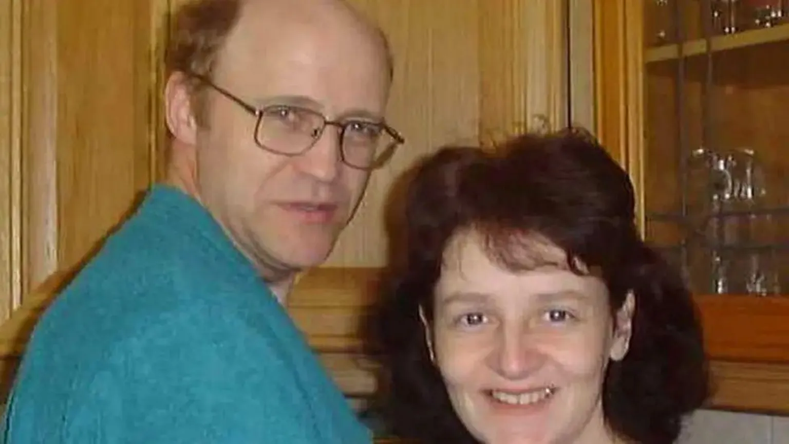 Greg Worrall A man wearing a blue jumper and sporting spectacles stands with a woman who has brown hair, both are looking at the camera