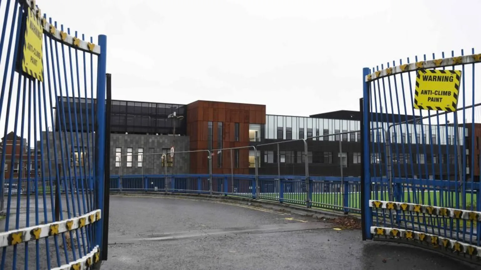  A shot of a new building from the gated entrance. 