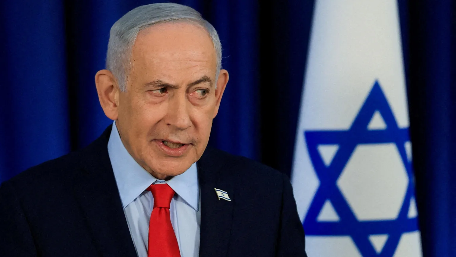  FILE PHOTO: Israeli Prime Minister Benjamin Netanyahu, wearing a dark suit, red tie and light blue shirt, speaks during a news conference