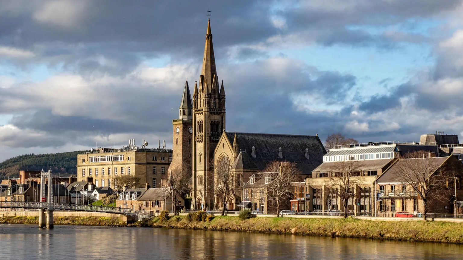  An image of the city centre of Inverness, as seen across the River Ness, against a moody cloudy sky