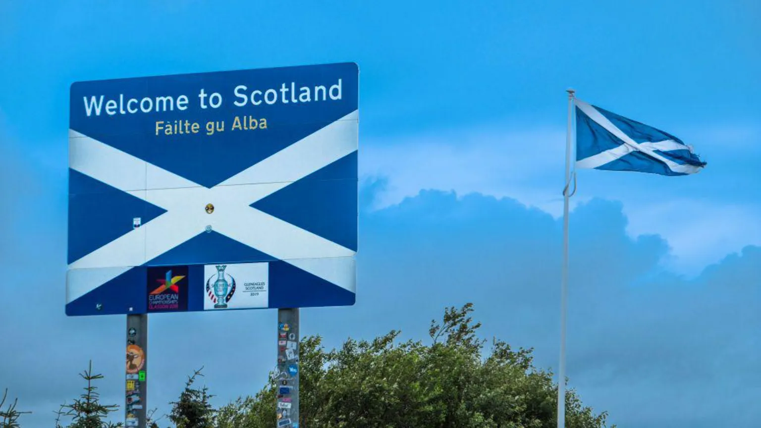  An image of the Welcome to Scotland sign on the A68 road across the Scotland-England border
