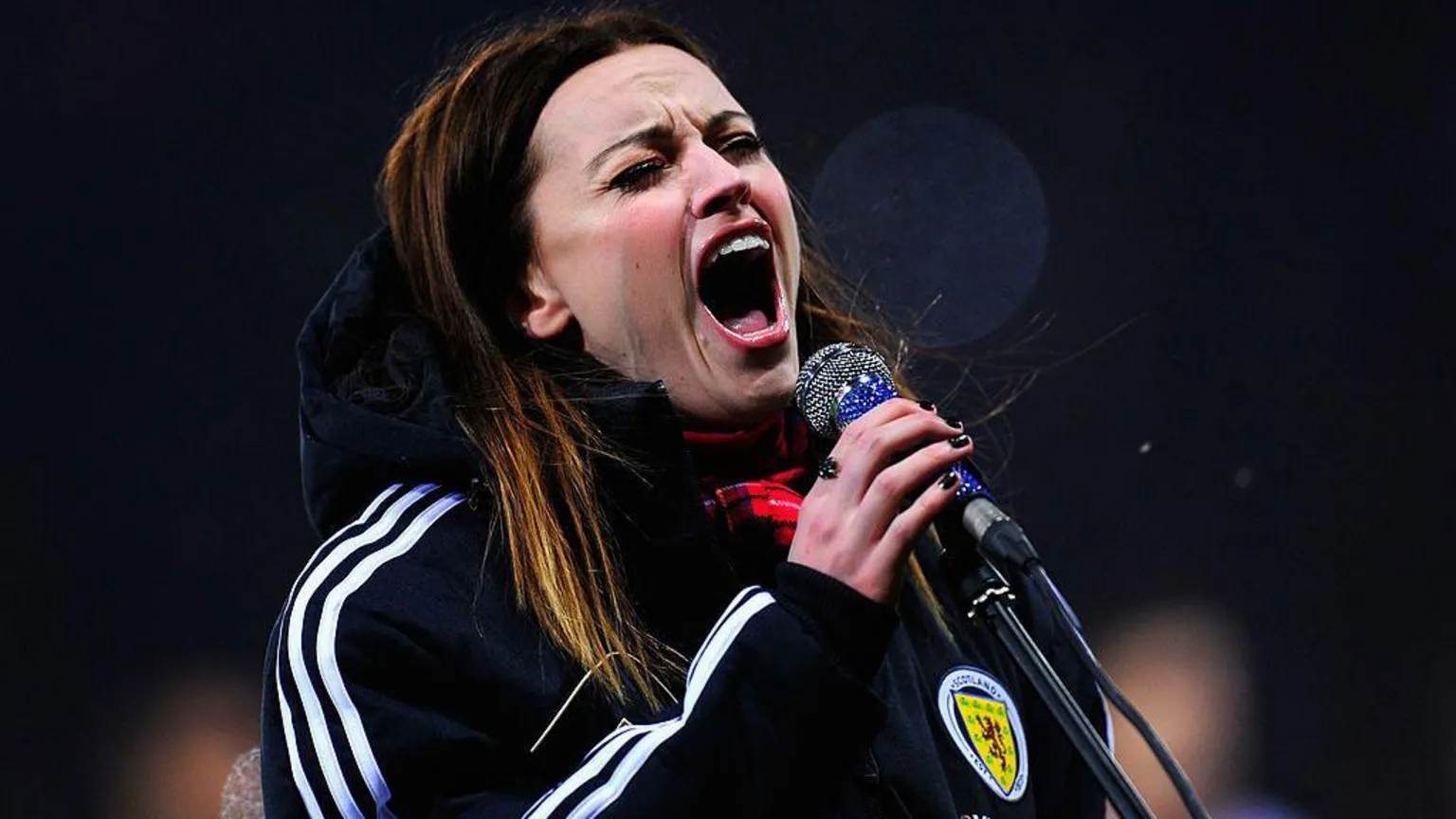 Amy Macdonald singing at Hampden Park, wearing a tracksuit with the Scotland logo on it