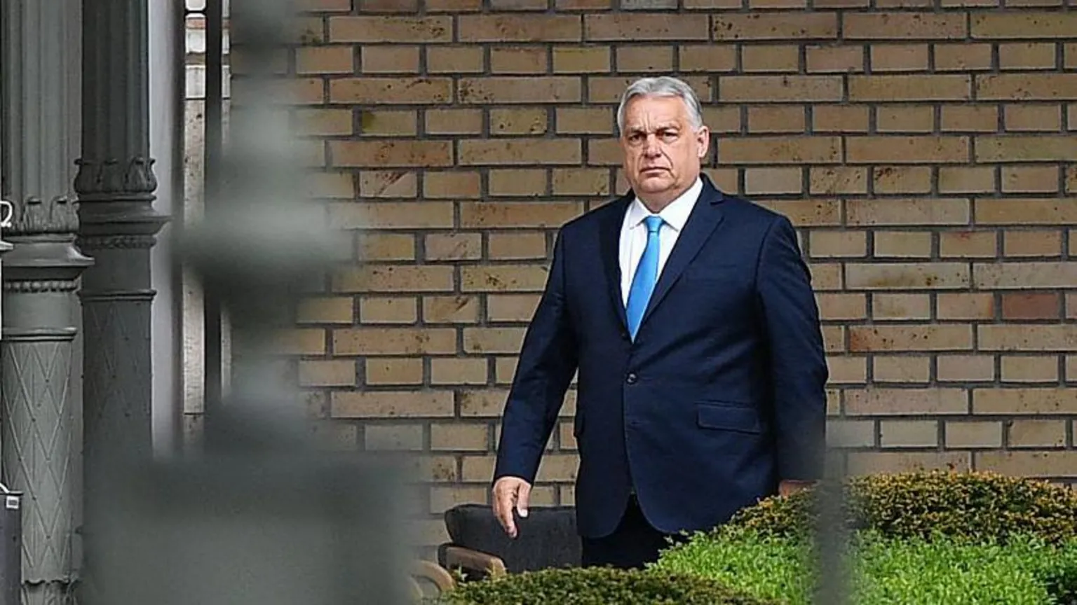 Ferenc Isza/AFP via Outgoing Hungarian Prime Minister Viktor Orban, wearing a blue suit and light-blue tie, arrives at the presidential Sandor Palace in Budapest on April 15, 2026 to meet Hungary's president