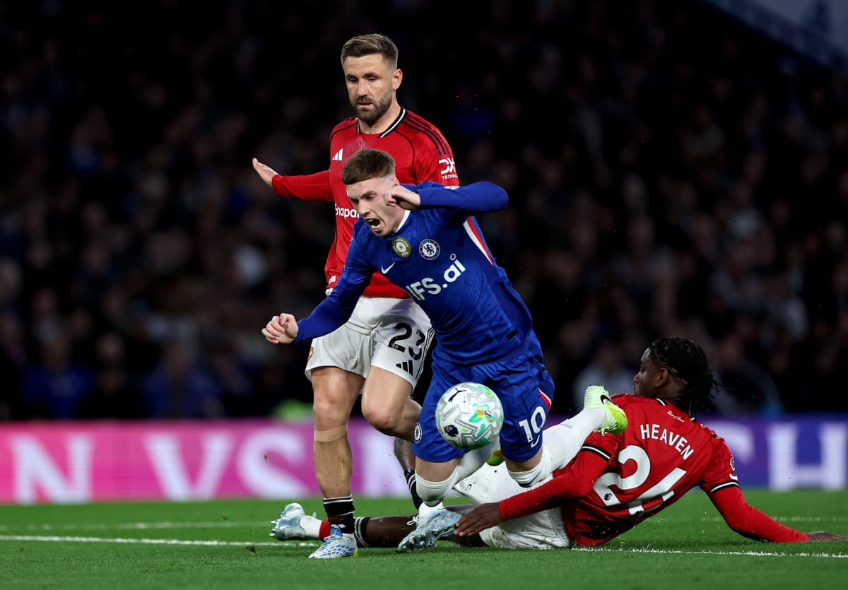 Cole Palmer goes down iunder a challenge fromn Ayden Heaven.