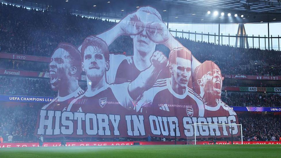Arsenal fans displayed a Tifo banner which proclaimed 'history in our sights' before Wednesday's Champions League quarter-final against Sporting - this season they are trying to become champions of Europe for the first time, and hoping for their first Premier League title since 2004