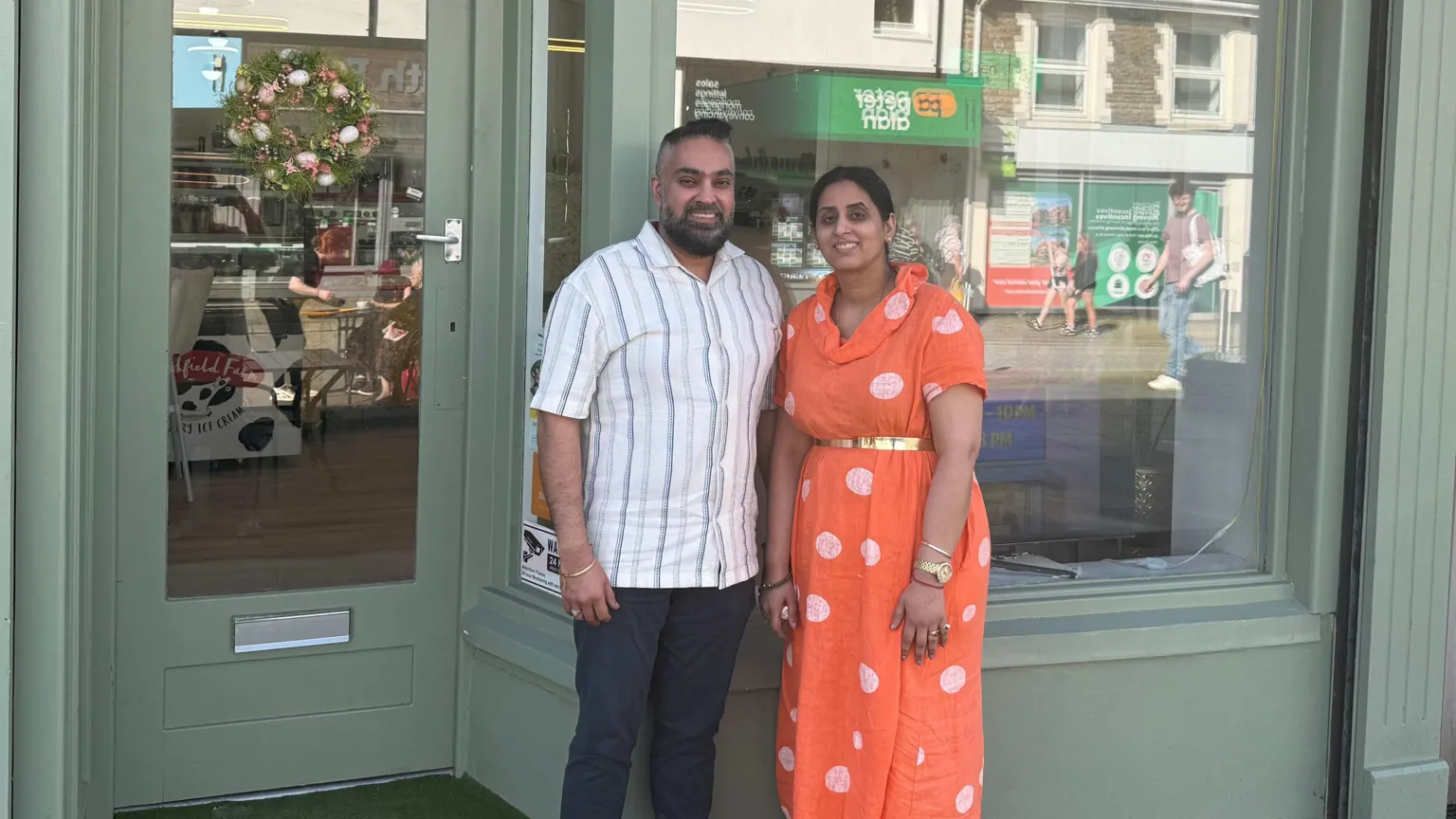 BBC Wales A couple stand outside a shop 