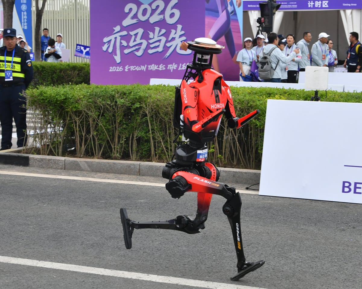 A humanoid robot running along a street