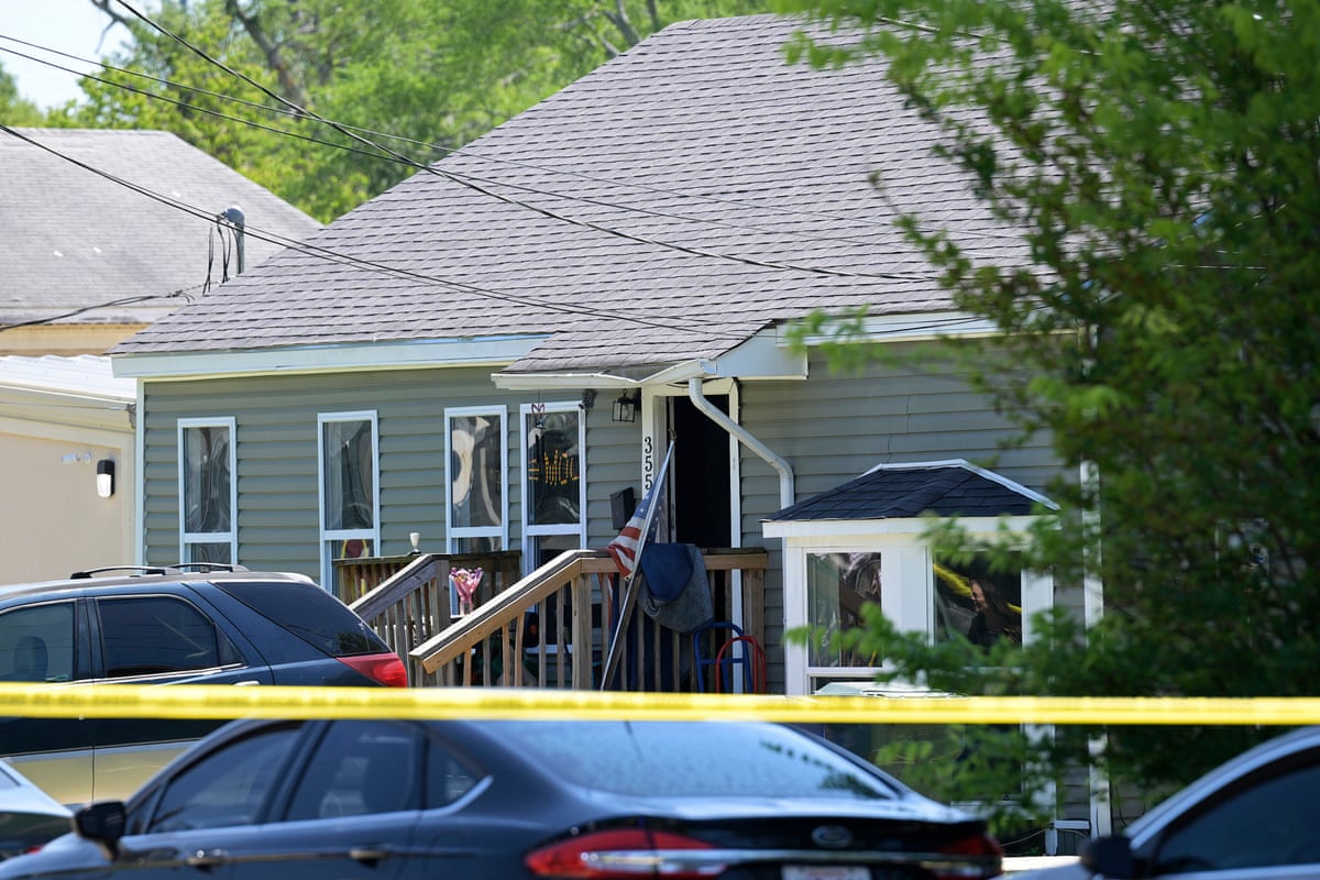 police tape in front of a house 