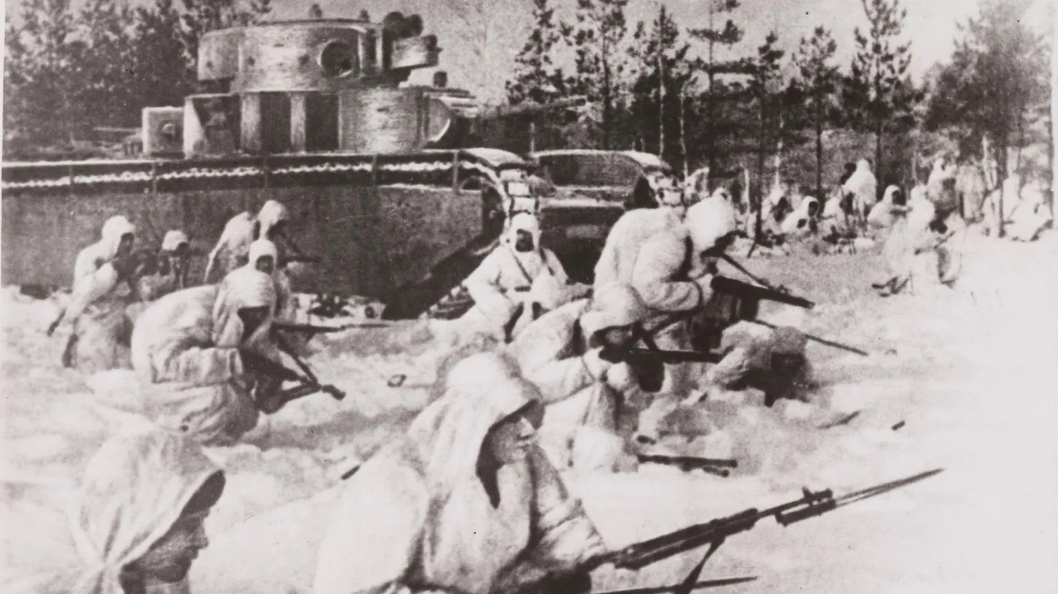  A photograph of the Soviet infantry, in white snow camouflage, pressing back the German Army on the Leningrad front. 