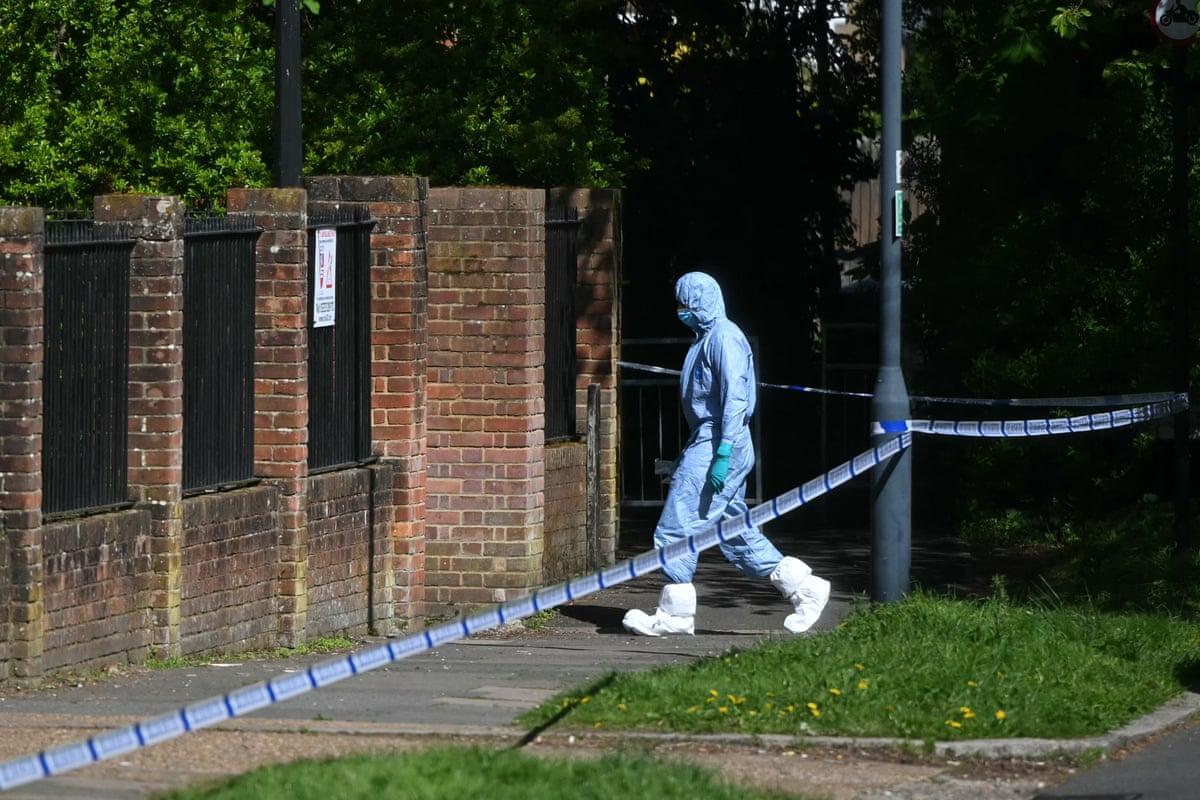 A police forensic officer works inside a cordon set up near Kenton United Synagogue in Harrow, north-west London.