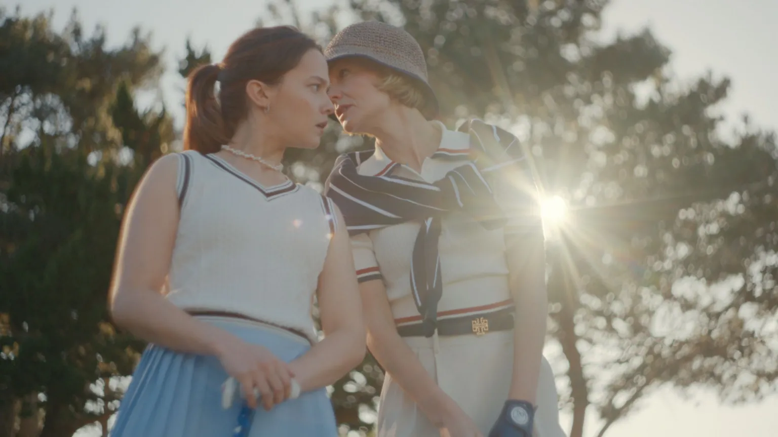 Netflix Carey Mulligan and Cailee Spaeny in tennis gear, talking to each other 