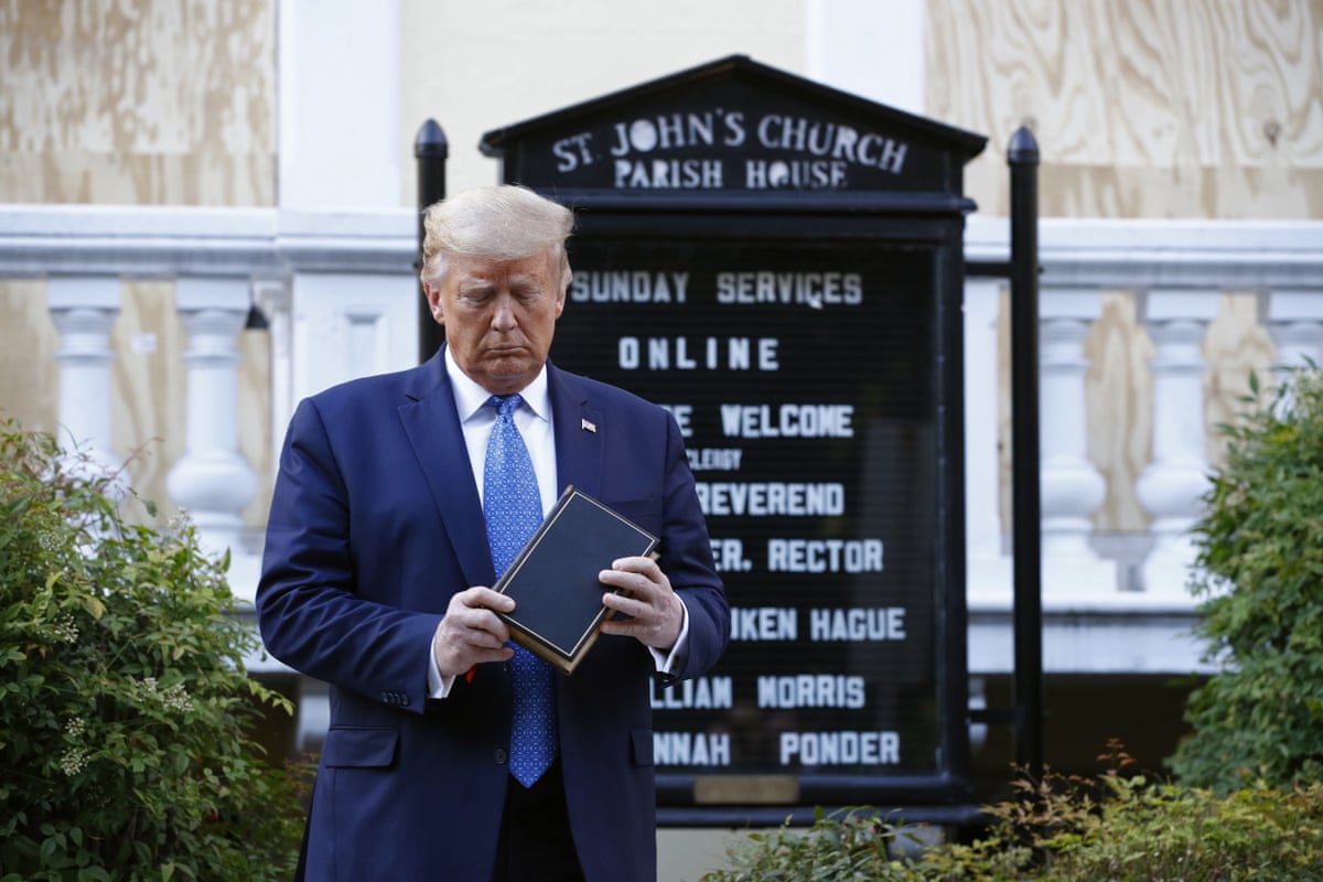 President Donald Trump holding a Bible during a visit outside St. John's Church across Lafayette Park from the White House in Washington.