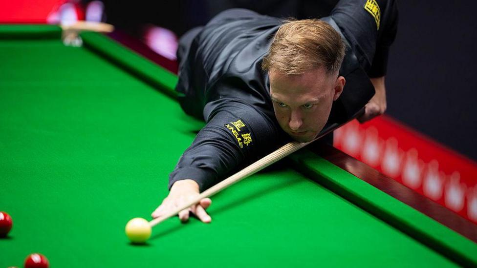 Judd Trump in action at the World Snooker Championship