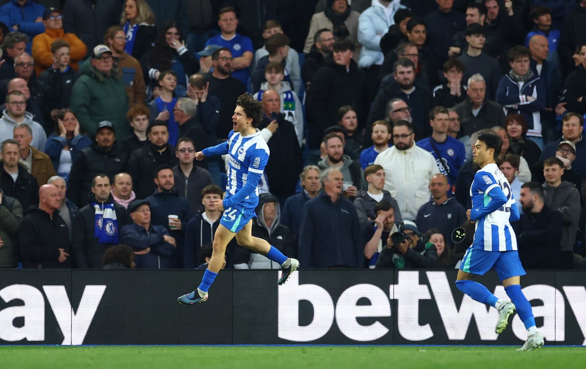 Brighton & Hove Albion's Ferdi Kadioglu leaps in the air as he celebrates opening the scoring.