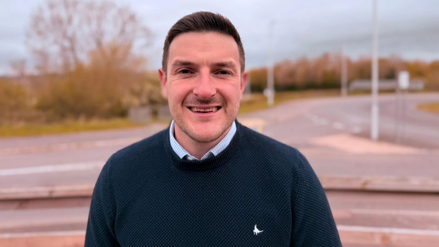 A man, James Evans, smiling at the camera