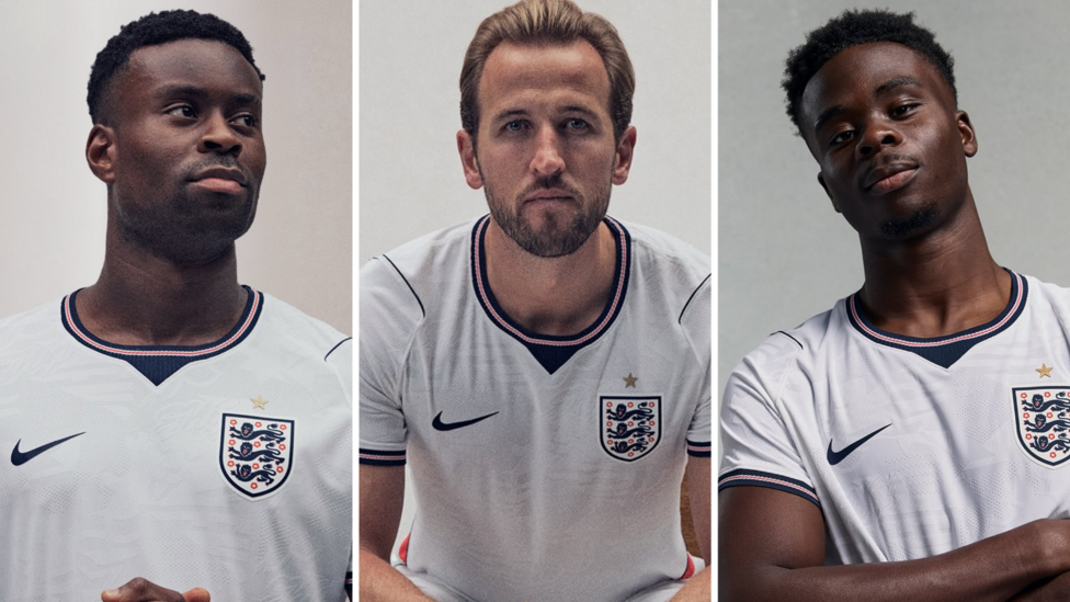 Marc Guehi (left), Harry Kane (middle) and Bukayo Saka (right) wear 2026 England home shirt.