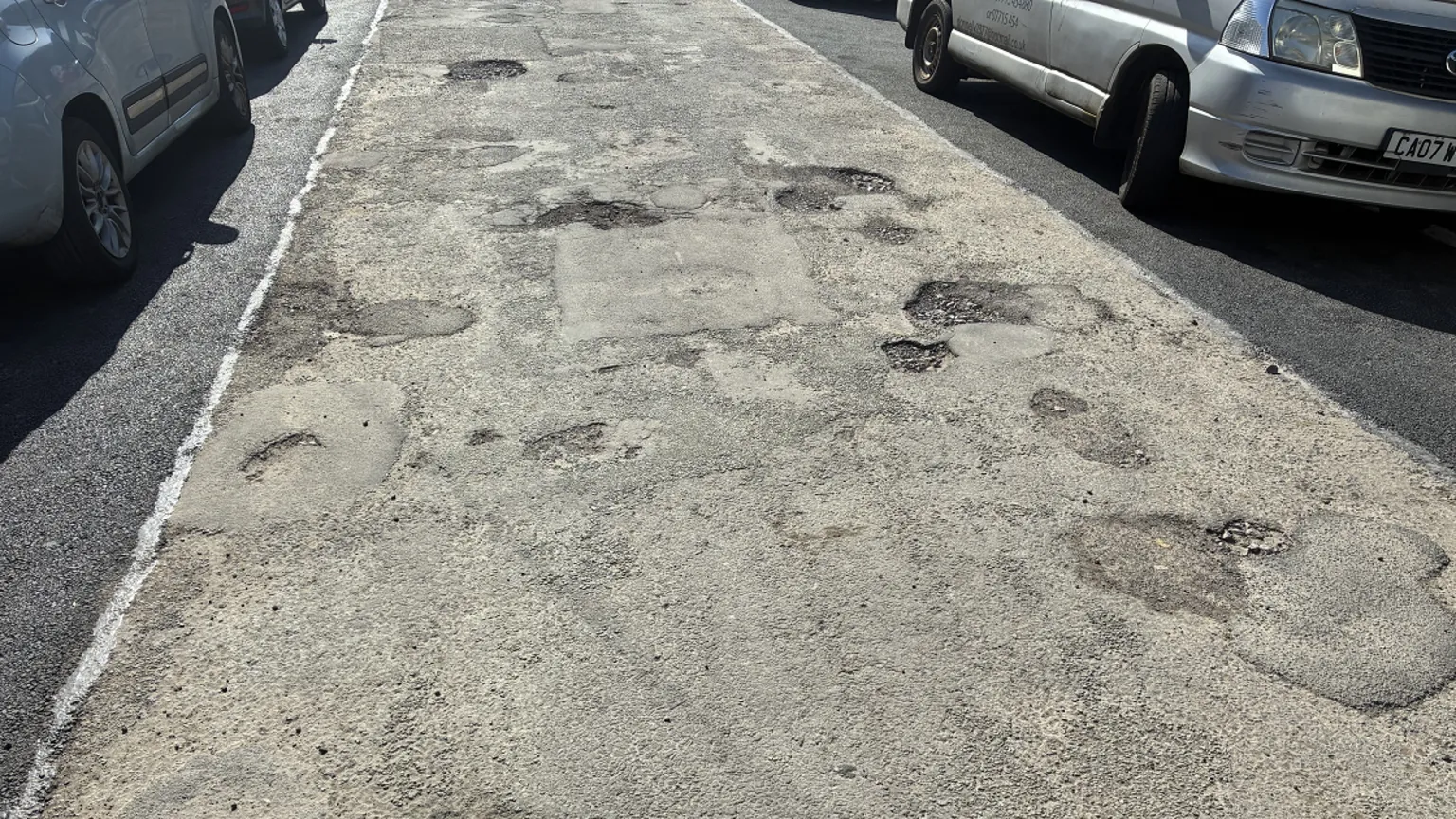 Kieran Molloy the middle of the road with damage and either side repaired