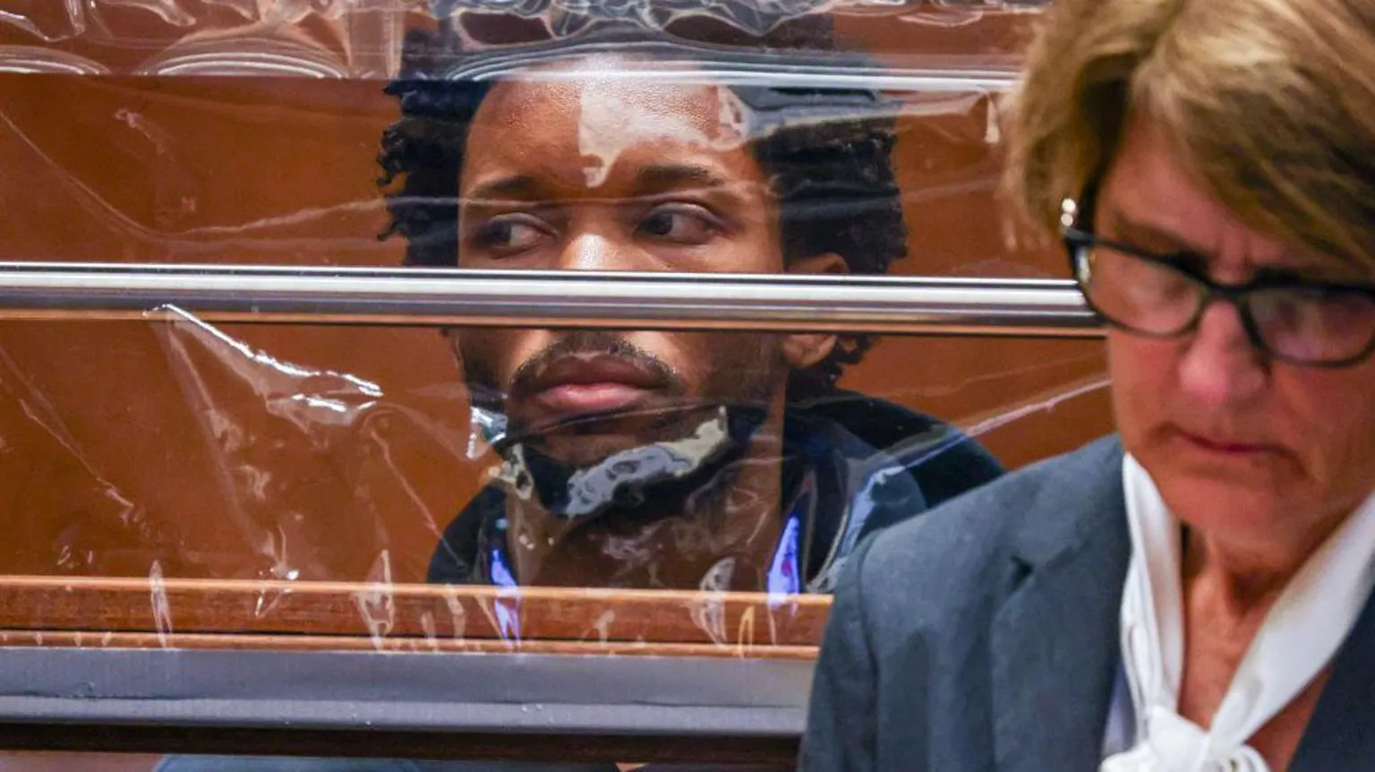  US singer D4vd looks on from behind a clear screen as his defence attorney Marilyn Bednarski appears with him in court during his arraignment for the murder of Celeste Rivas Hernandez at Clara Shortridge Foltz Criminal Justice Center on 20 April 2026 in Los Angeles, California.