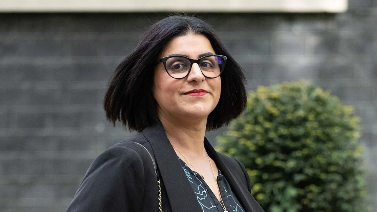 Rasid Necati Aslim/Anadolu via Home Secretary Shabana Mahmood, in a black suit jacket and black-rimmed glasses, arrives at Downing Street to attend the weekly cabinet meeting in London