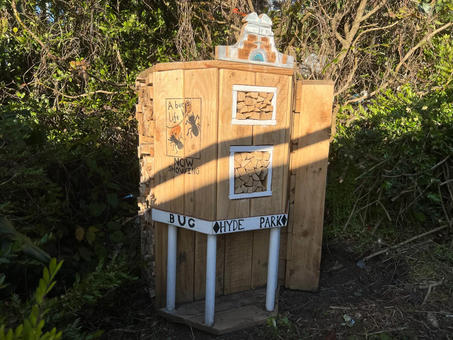 Jessica Bayley/BBC A wooden structure made to look like Hyde Park Picture House, with 'Bug Hyde Park' written on the front.