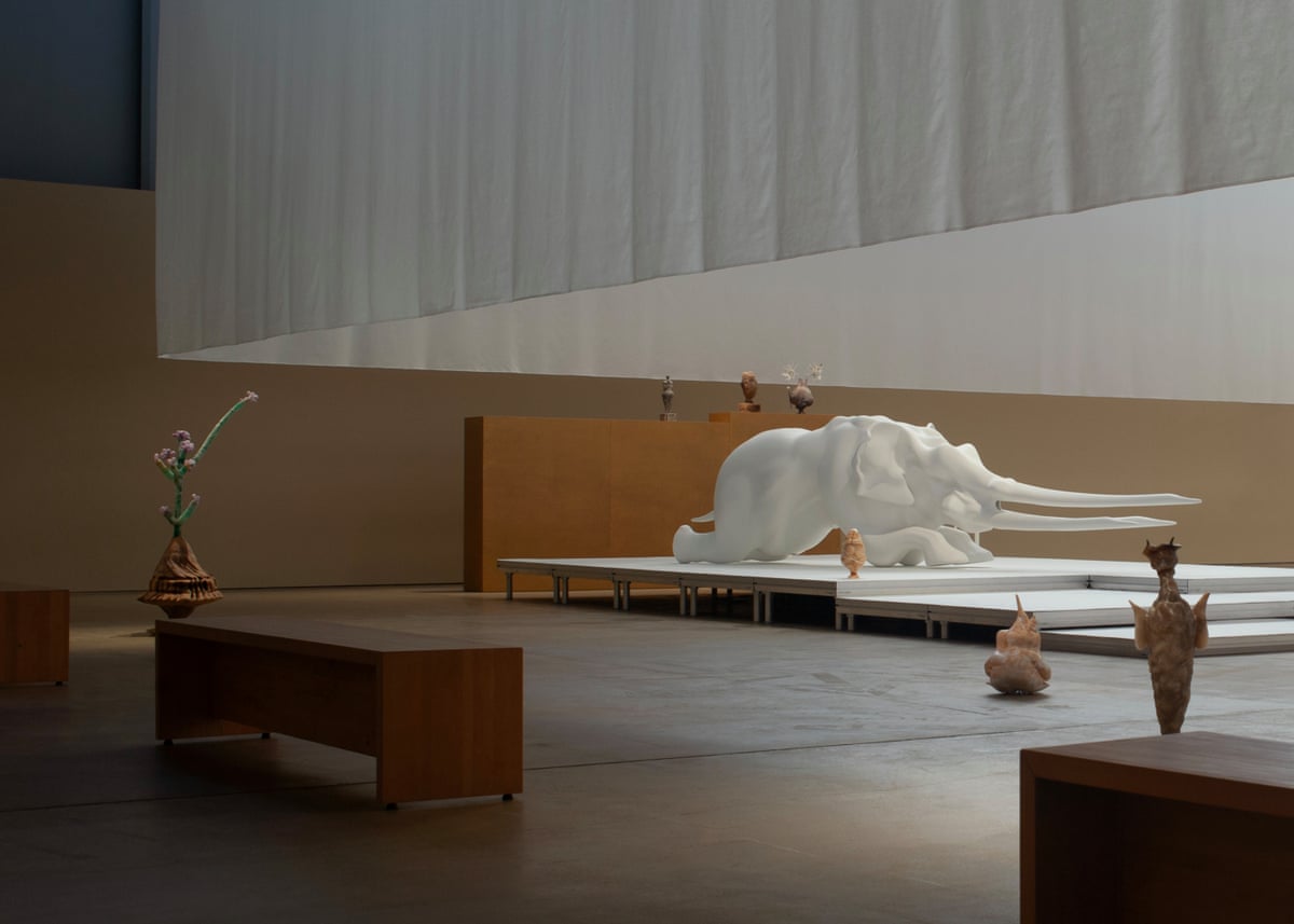 A sculpture of a white rhinoceros-type animal with exaggerated tusks forms part of the exhibiton.