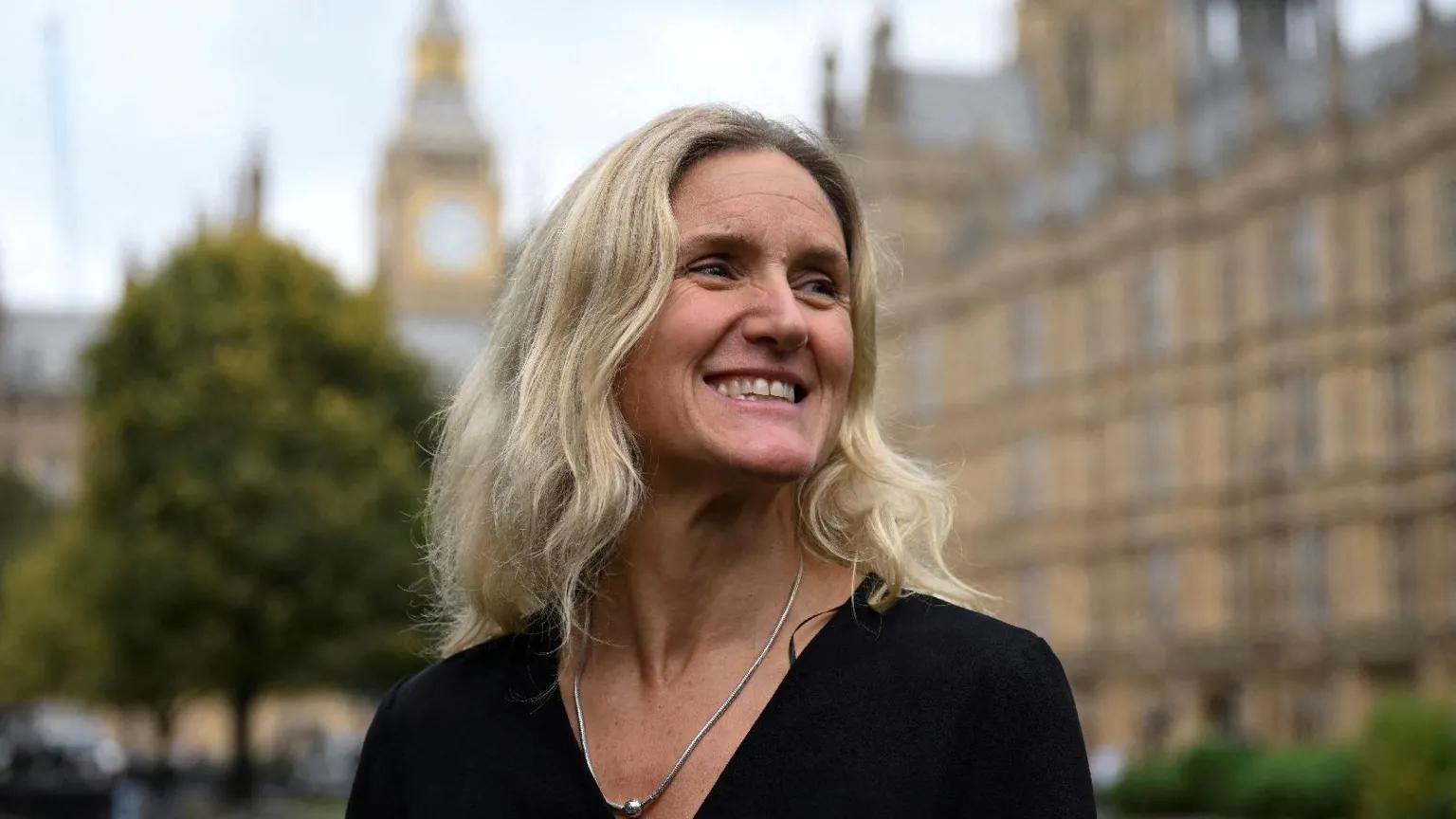  Labour MP Kim Leadbeater smiles standing outside Parliament.