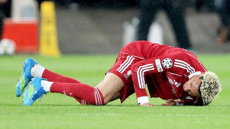 Hugo Ekitike of Liverpool is injured during the UEFA Champions League 2025/26 Quarter-Final Second Leg match between Liverpool FC and Paris Saint-Germain FC at Anfield on April 14, 2026 in Liverpool, England.