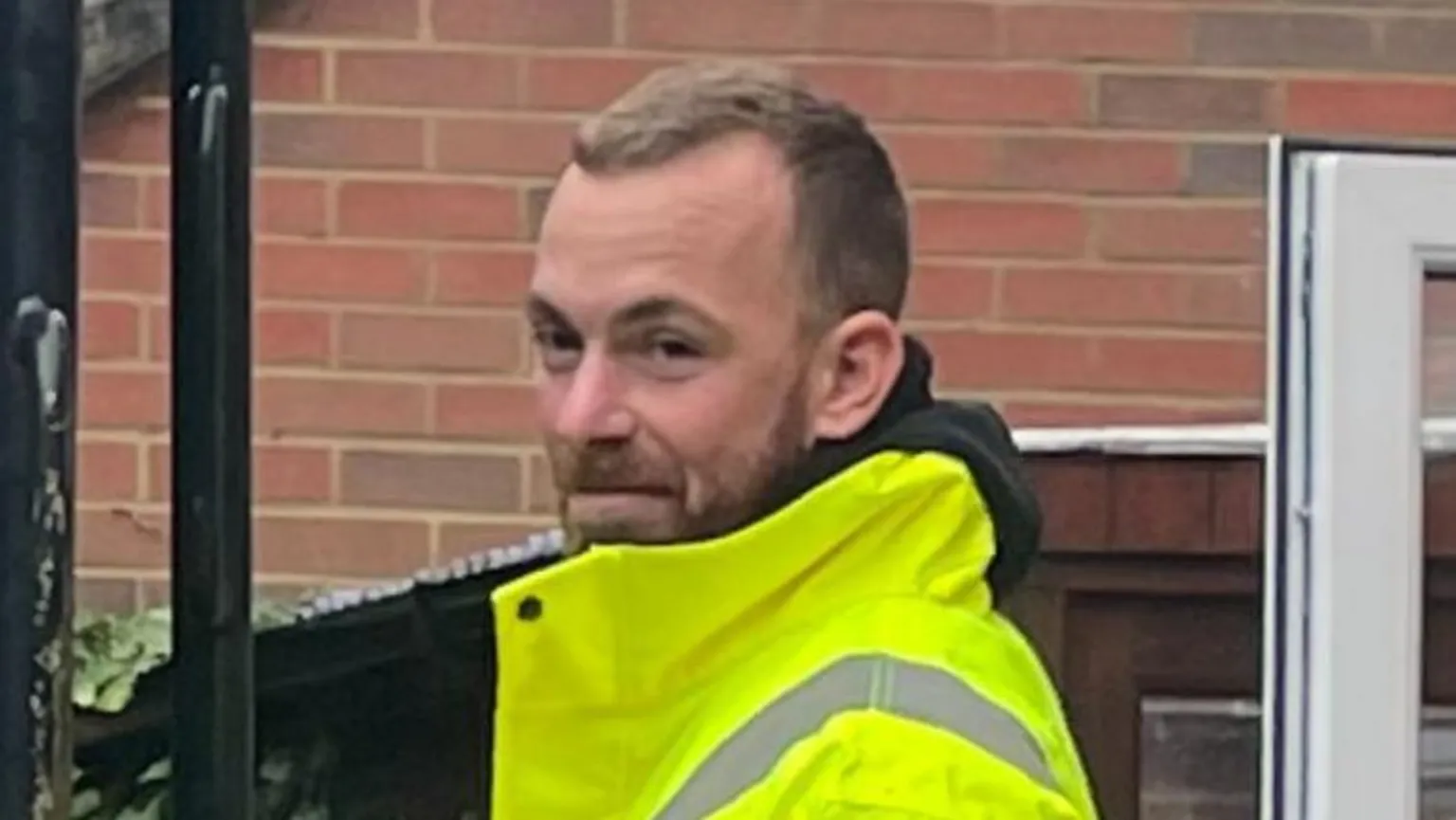 Rob Davies Steve Figg has short blond hair and is wearing a hi-vis jacket during an outdoor building project.