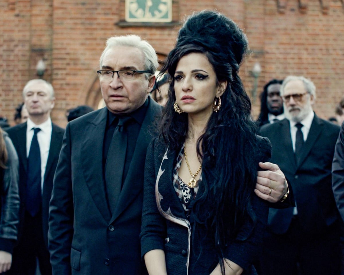 Eddie Marsan and Marisa Abela portraying Mitch and Amy Winehouse in a funeral scene in the film Back to Black