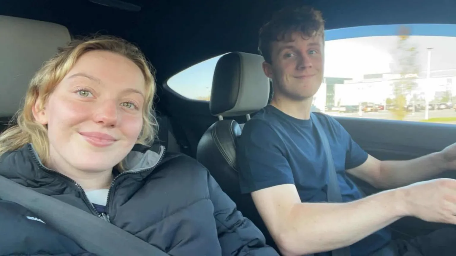 Katie Bain A selfie taken in a care by Katie of herself and her partner Ben, who is driving.