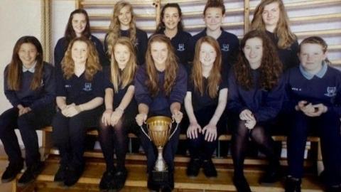 Meg Jones as part of a school hockey team photo